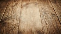 Rustic weathered wood planks with natural grain texture and warm brown tones creating organic surface for product display and design projects.