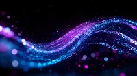 Magical glowing wave with sparkling particles in blue and purple colors flowing on black background, abstract light effect for creative designs.