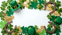 St. Patrick's Day frame with green shamrocks, leprechaun hats, horseshoes and gold coins on white background. Perfect for Irish holiday celebrations and festive designs.