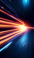 Dynamic light trails converging to bright center point with orange and blue streaks creating dramatic speed effect against dark background. For technology and future concepts.