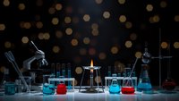 Laboratory equipment with microscope, beakers and test tubes on dark background with golden bokeh lights for scientific research and education.