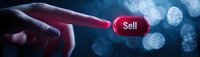 Finger pointing at glowing red sell button on dark background with bokeh lights, representing financial trading decisions and market transactions.