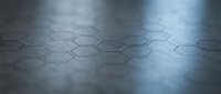 Hexagonal metallic surface with geometric pattern and reflective lighting, suitable for technology, science, and corporate design backgrounds.