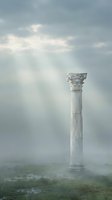 Ancient classical column with ornate Corinthian capital standing alone in misty landscape with dramatic sky and god rays, suitable for historical, architectural, and conceptual design projects.
