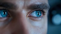 Young adult male with fair complexion and striking bright blue eyes gazing directly forward. Close-up portrait captures intense eye contact with detailed iris and pupil reflection. Suitable for psychology, emotion, vision, and human connection concepts.