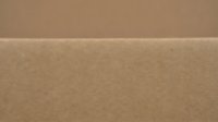 Natural brown kraft paper texture with smooth surface and subtle fiber details for packaging and craft projects.