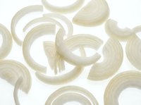 Abstract beige brushstrokes pattern on white background. Organic curved shapes create flowing artistic design for modern decor and creative projects.