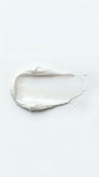 Creamy white paint stroke or cosmetic product smear isolated on light background, ready for design, packaging, and beauty marketing applications.