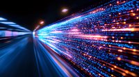 Dynamic light trails with blue and orange streaks creating futuristic motion effect against dark background, representing speed, technology and digital transformation.