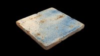 Weathered ceramic tile with blue and cream glaze, isolated on transparent background. Ready for design use in print-on-demand, sublimation, t-shirt graphics, clipart, and digital craft projects.