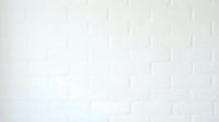 White brick wall texture with subtle shadow details, suitable for backgrounds, interior design projects, and architectural visualization.