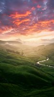 Dramatic sunset over rolling green hills with winding river through misty valley landscape, ideal for nature and travel backgrounds.