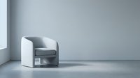 Modern gray and white upholstered armchair with curved design in minimalist interior space, suitable for furniture catalogs and contemporary home decor projects.