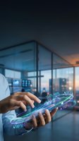 Businessman using smartphone with holographic stock market data visualization in modern office for financial analysis and trading applications.