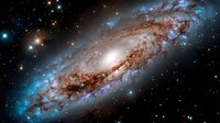 Majestic spiral galaxy with glowing center and sweeping dusty arms illuminated by countless stars against deep space background, showcasing cosmic structure.