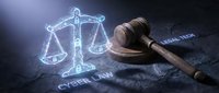 Digital justice concept with glowing scales and wooden gavel on dark surface representing cyber law, legal technology, and modern jurisprudence systems.