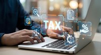 Young man hands typing on laptop with glowing TAX digital icons, online tax filing and financial management concept for business.