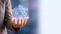Businessman holding glowing geometric wireframe structure in palm, representing digital innovation, network connectivity, and futuristic technology solutions for business.
