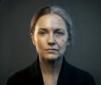 Split face portrait showing aging process from young to elderly woman with wrinkles and gray hair transformation concept for skincare and time passage.