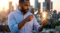 African American businessman examining glowing light bulb with magnifying glass surrounded by question marks against city skyline at sunset for innovation concepts.