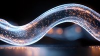Glowing wave of sparkling particles flowing in dark space creating magical light trail effect with bokeh reflections and luminous motion path.