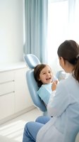 Happy young girl laughing during dental checkup with female dentist in modern clinic office for pediatric oral health care and preventive treatment.