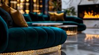 Luxurious teal velvet sofa with golden base against modern fireplace background. Elegant living room interior with soft ambient lighting and decorative pillows.