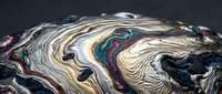 Abstract fluid art with swirling metallic colors creating organic flowing patterns on dark background for modern design projects.
