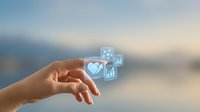 Hand reaching toward floating digital healthcare icons with heart and medical cross symbols representing telemedicine and digital health technology solutions.