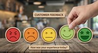Hand selecting excellent rating from customer satisfaction survey with colorful emoji faces from angry to happy for service quality evaluation.