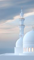 White mosque minaret and dome against soft blue sky background. Architectural details of Islamic religious building with gentle lighting creates serene atmosphere.