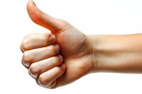 Caucasian hand showing thumbs up gesture against white background, positive approval and success concept for business and social media communication.