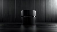 Minimalist black cosmetic jar on dark wooden surface with dramatic lighting. Luxury skincare packaging mockup for premium beauty product presentation.