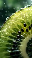 Fresh kiwi slice with water drops in macro view showing juicy pulp and black seeds against blurred green background, natural food photography.