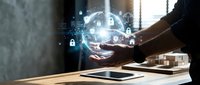 Businessman hand touching digital globe with security icons and network connections for cybersecurity, data protection, and global technology solutions.