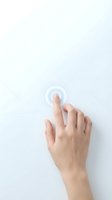 Human hand finger touching transparent digital button interface on clean white background for technology and user experience design.