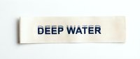 White rectangular label with bold navy blue text reading DEEP WATER on clean background for maritime signage and safety applications.