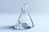 Clear glass conical laboratory flask with geometric pattern design on white background, isolated scientific glassware for chemistry experiments and research.