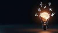 Glowing light bulb with brain inside surrounded by floating renewable energy and sustainability icons on dark background for innovation concepts.