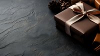 Brown gift box with satin ribbon bow and pine cones on dark stone background with copy space. Elegant holiday present packaging for special occasions.