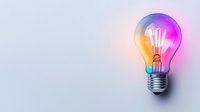 Glowing light bulb with colorful neon gradient illumination on light background, creative innovation and inspiration concept for business solutions.
