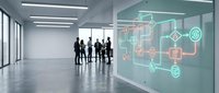 Business professionals viewing digital network interface with connected icons in modern office corridor for technology presentations.