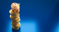 Pink piggy bank sitting on top of tall stack of golden coins against blue gradient background representing savings growth and financial planning.