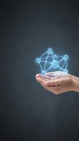 Hand holding glowing molecular structure with H2O chemical formula and connected nodes on dark background for science, chemistry, and research concepts.