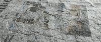 Natural stone wall texture with weathered granite blocks showing rough surface patterns and organic mineral variations for architectural backgrounds.