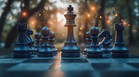 Chess pieces on board with magical bokeh lights and sunset glow in background creating atmospheric mood for strategy and leadership concepts.