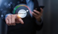Businessman touching cybersecurity gauge interface with smartphone showing digital protection level meter for network security assessment and data safety.
