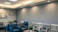 Modern medical office waiting room with comfortable seating and professional lighting for healthcare facility interior design and patient care environments.