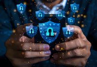 Digital security concept with glowing blue shields and lock icons floating above smartphone, representing cybersecurity and data protection in mobile devices.