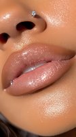Close-up of glossy nude lips and nose with sparkly diamond nose piercing, featuring dewy skin texture and shimmering makeup effect for beauty and cosmetic advertising.